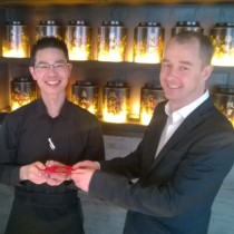 Hutong Operations Director Tony Geary handed staff red pockets containing a gift from the company.